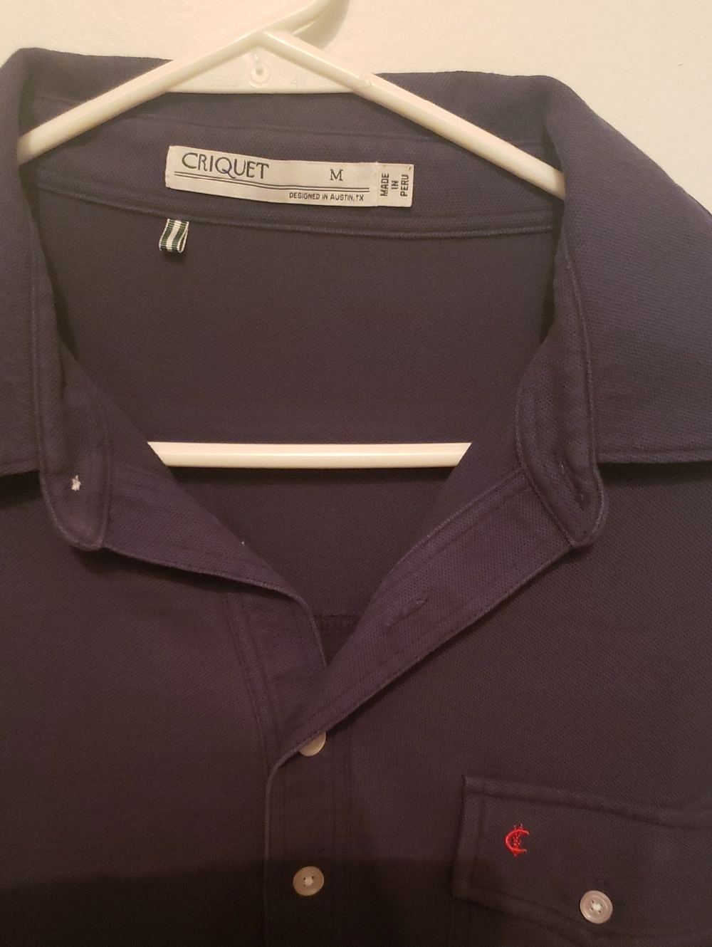 Criquet Navy Button-Up Polo with Small Red Chest Logo